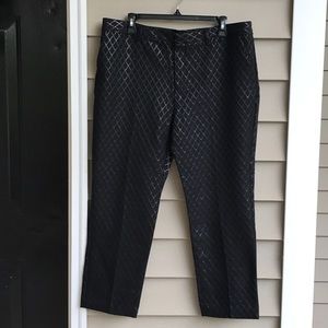 Black pattern over black, dressy ladies slacks.